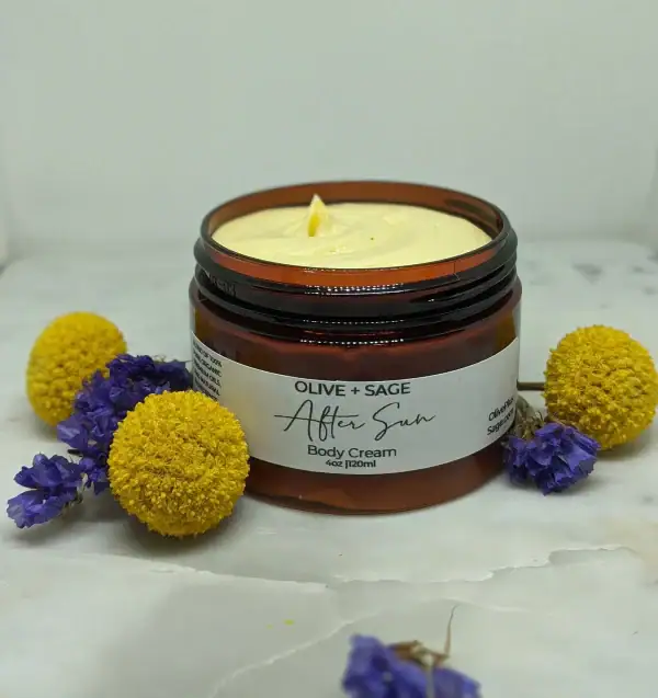 Moisturizing After Sun Body Cream texture with daisy pom poms for sun care