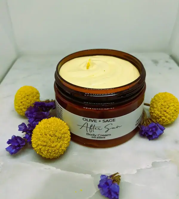 After Sun Body Cream texture surrounded by daisy pom poms, natural skin relief