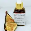 Botanical AHA Face Oil in a glass dropper bottle with a cut fig, promoting exfoliation and skin rejuvenation.