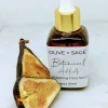 Botanical AHA Face Oil in a glass dropper bottle with a cut fig, promoting exfoliation and skin rejuvenation.