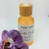 Exotic Orchid Face Oil in closed dropper bottle with orchid flower – Organic, anti-aging skincare for glowing, youthful skin.