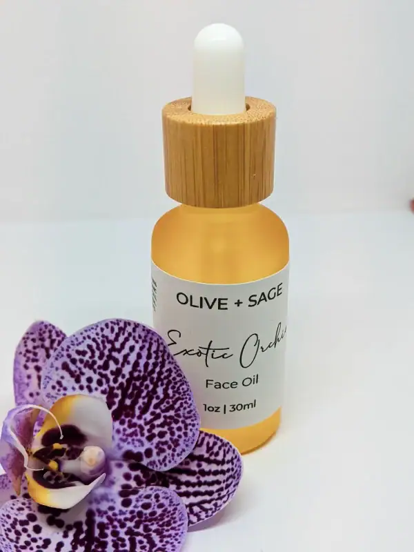 Exotic Orchid Face Oil in closed dropper bottle with orchid flower – Organic, anti-aging skincare for glowing, youthful skin.