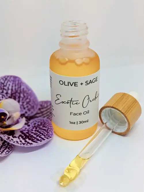 Exotic Orchid Face Oil in dropper bottle with orchid flower – Calming, brightening, and anti-aging organic face oil.