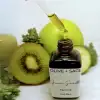 Organic Green Smoothie Face Oil for glowing skin in glass bottle with dropper showing product.