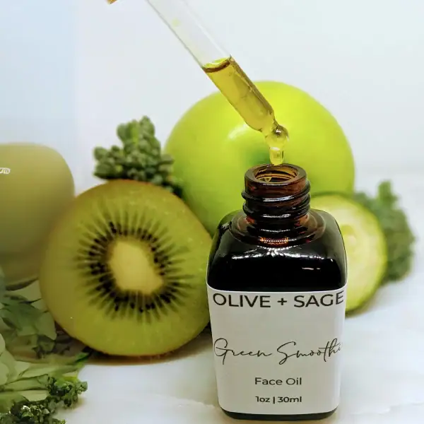 Organic Green Smoothie Face Oil for glowing skin in glass bottle with dropper showing product.