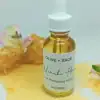 Manuka Flower Skin Protecting Serum in dropper bottle surrounded by honey