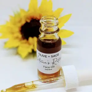 Nature’s Retinol Face Oil bottle with dropper resting beside it and sunflower in background. Plant-based retinol alternative by Olive + Sage.