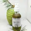 Organic After Shave Oil in spray bottle with pine cone and soft natural elements.