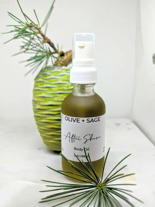 Organic After Shave Oil in spray bottle with pine cone and soft natural elements.