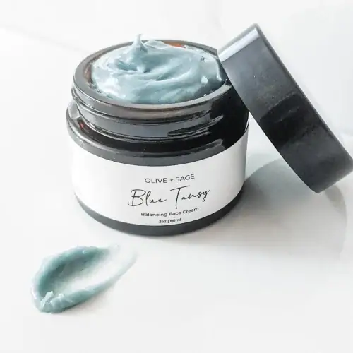 Organic Blue Tansy Moisturizer smear showing smooth texture and botanical-rich consistency.