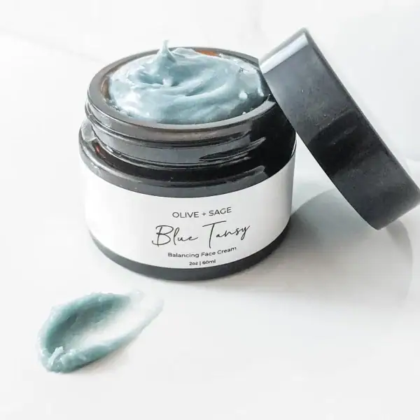 Organic Blue Tansy Moisturizer smear showing smooth texture and botanical-rich consistency.