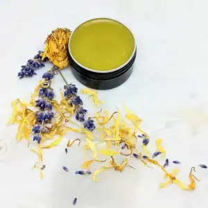 Organic bug bite salve jar with natural ingredients