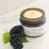 Organic Poreless Nectar Face Cream texture with blackberries next to jar