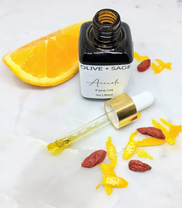 Close-up of Vitamin C Face Oil dropper with oranges – glowing skin serum with THD Ascorbate