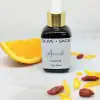 Glass dropper bottle of Vitamin C Face Oil with orange slices – glow-boosting, natural skincare