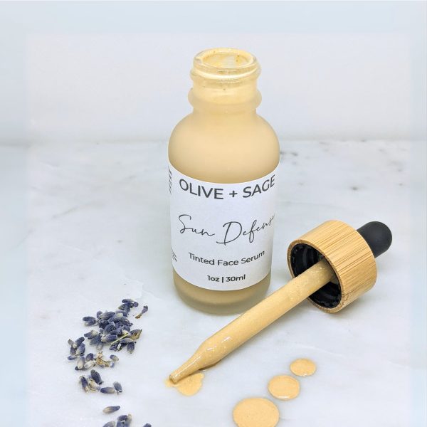 Zinc oxide face oil with visible product drops and natural sheen