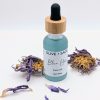 Blue Lotus Face Oil 1 oz glass dropper bottle with blue lotus flowers, premium botanical facial oil for sensitive skin