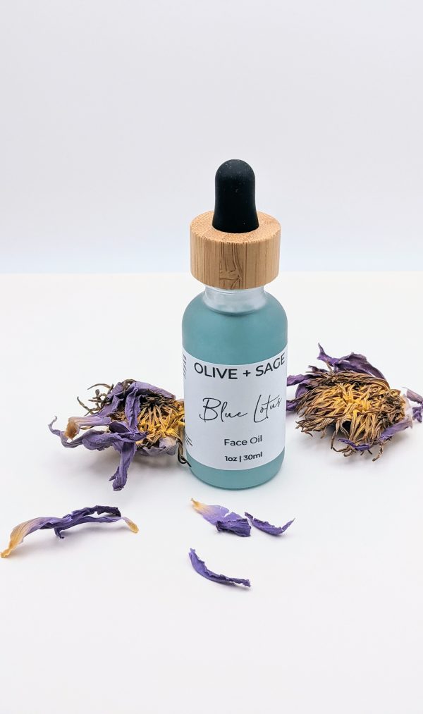 Blue Lotus Face Oil 1 oz glass dropper bottle with blue lotus flowers, premium botanical facial oil for sensitive skin
