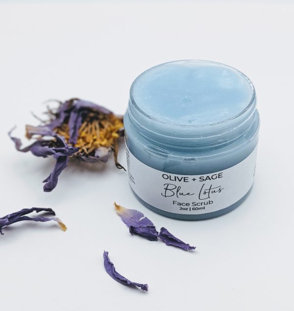 Open jar of Blue Lotus Face Scrub with blue lotus flower showing the texture