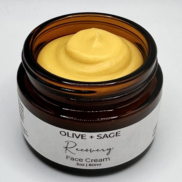 Whipped swirl texture of Recovery Face Cream in amber jar