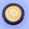 Top view of Recovery Face Cream with golden whipped texture