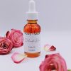 Delicate Rose Face Oil bottle with natural roses and petals